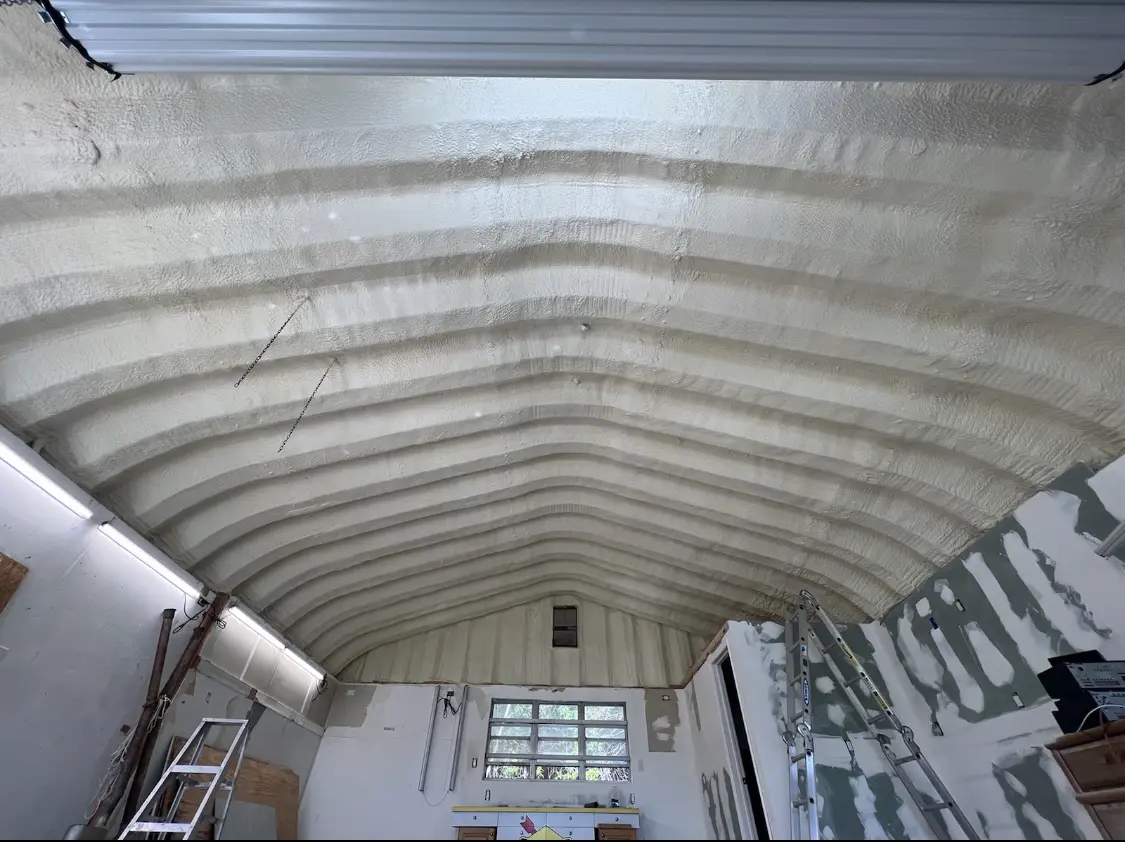Spray polyurethane foam applied to the underside of a metal roof deck in Brookfield